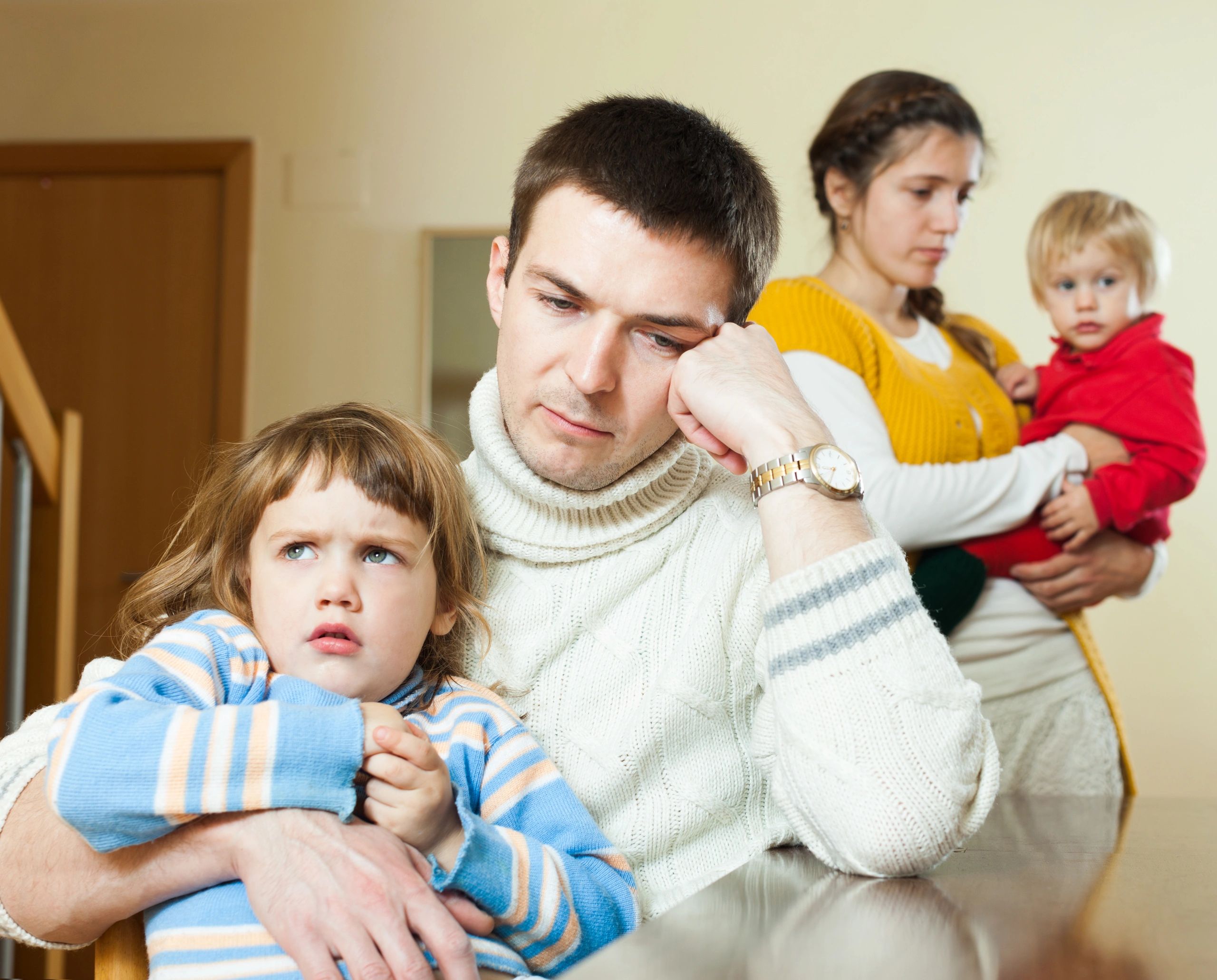 Family of four parents and children indoors